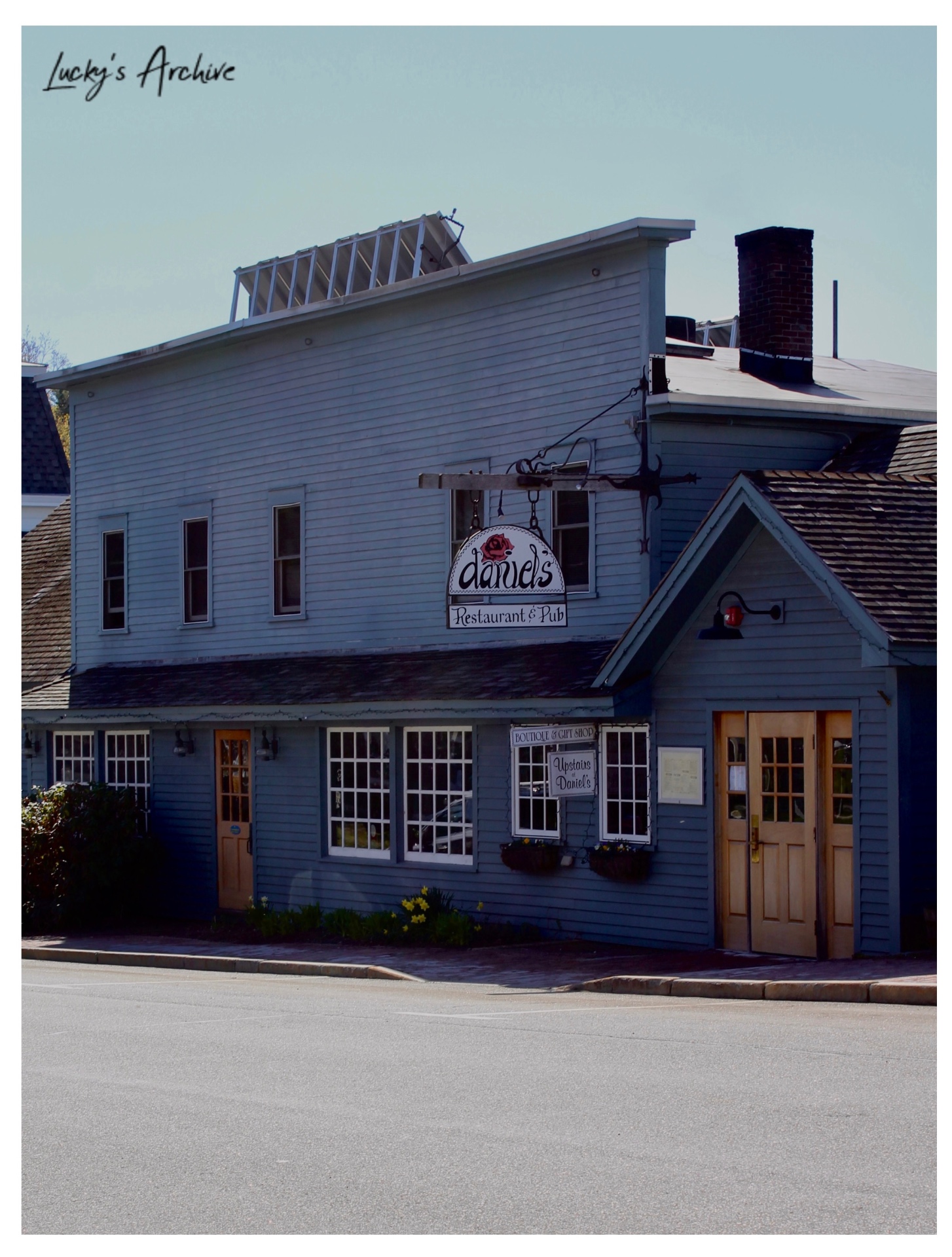 Blue clapboard building housing Daniel's Restaurant & Pub