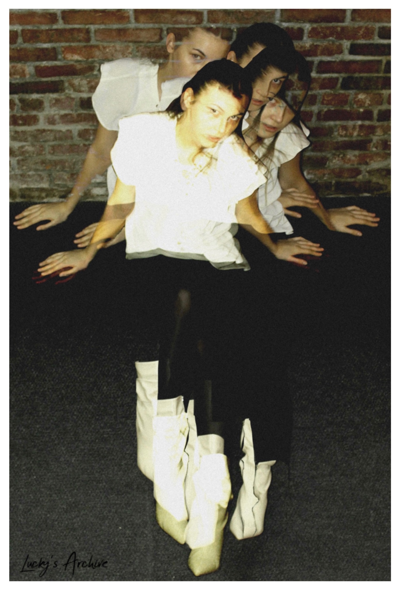 Multiple-exposure portrait against a brick wall