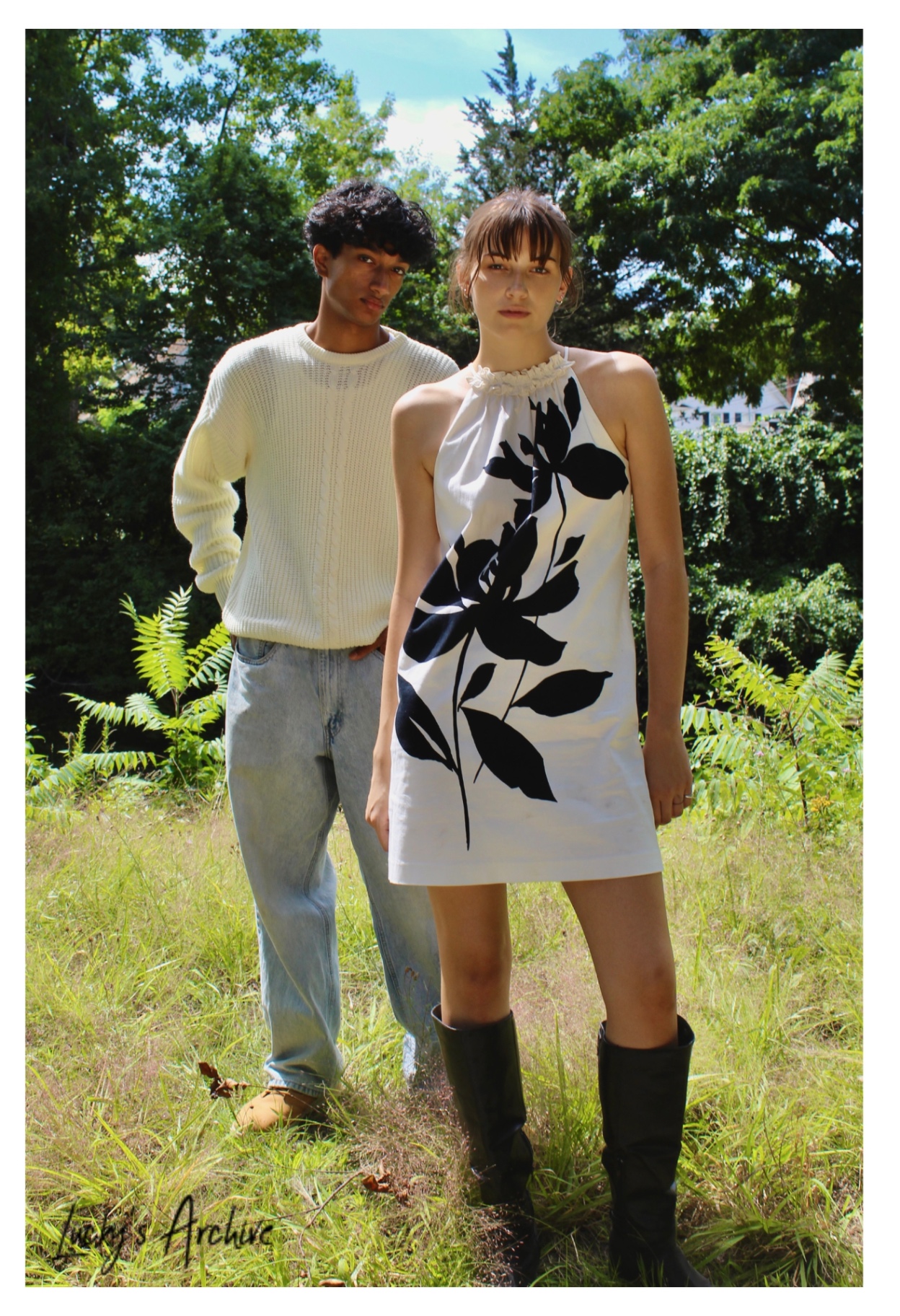 Full-length couple portrait in a summer meadow